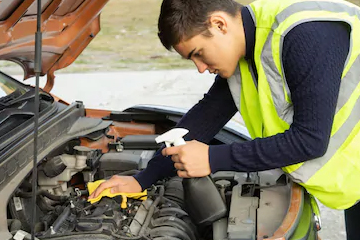 emergency roadside assistance technician cleans emergency roadside assistance technician cleans